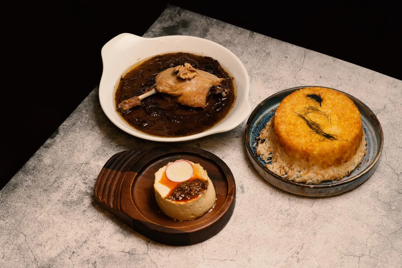 Duck stew, saffron tahdig and a Persian appetiser served together