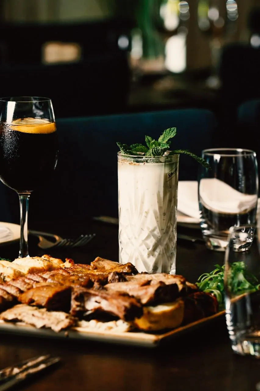 A grilled sharing platter served with drinks at Rendezvous
