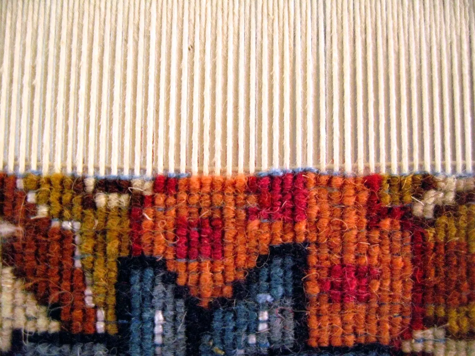 A carpet being woven in Mahan, Iran