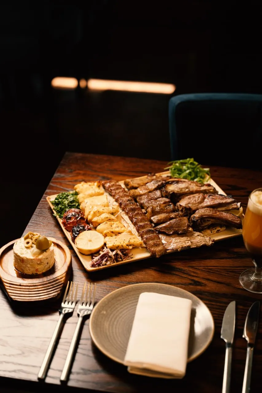 A kebab sharing platter arranged on a dining table